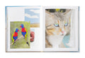 Open photography book "Promise Land" by SPBH Editions showing black-and-white landscape images on glossy pages.