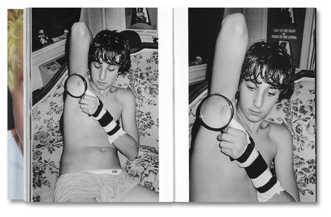 Open photography book titled "Chronograph" by SPBH Editions, showcasing black and white photography pages.