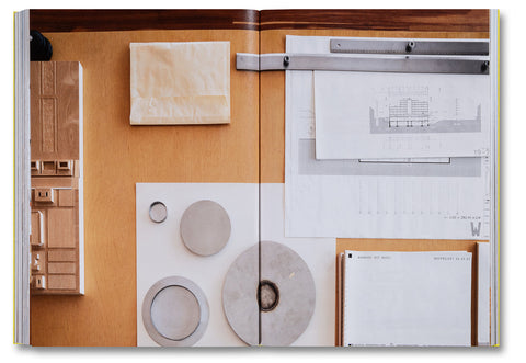 Open page of Donald Judd Spaces art book by Judd Foundation, featuring minimalist art and architectural photographs.