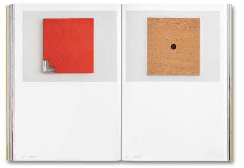 Open art book titled "Donald Judd Spaces" showcasing photographs and designs of Judd Foundation's architectural works.