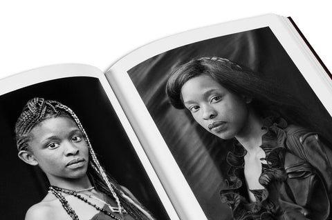 Close-up of the "Faces and Phases" photography book by MACK, showing detailed cover art and textured design.