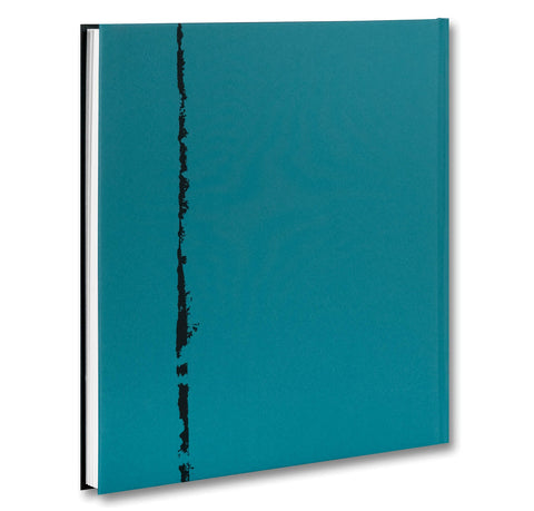 Open photography book titled Mountain Black Heart by MACK showing a landscape with a mountain scene on a white background.