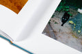 Close-up of the cover of Mountain Black Heart photography book by MACK, featuring a dark mountain landscape with a heart motif.