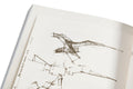 Close-up of the cover detail of the book "Prefigured: Fashion and Exhibition-Making" by SPBH Editions, showcasing intricate design elements.