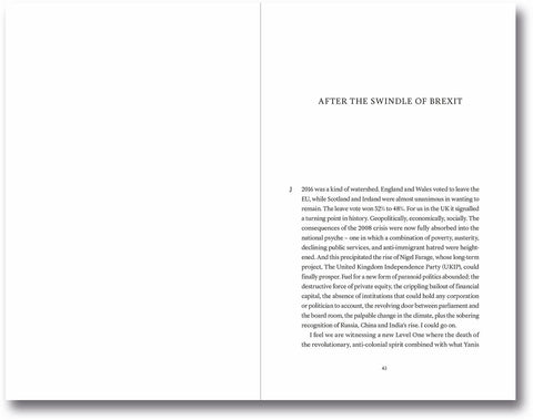 Open book titled "Transitions: On Culture, Crisis, and the Human" by MACK, featuring text and artistic design on the pages.