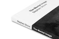 Close-up of "The Mental Image" photography book by MACK, showing detailed cover design and textured surface.