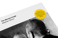 Close-up of the cover of "The Mental Image" photography book by MACK, showing detailed artwork and textured surface.